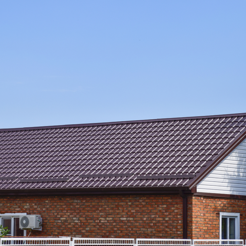 The roof of corrugated sheet. Roofing of metal profile wavy shape.